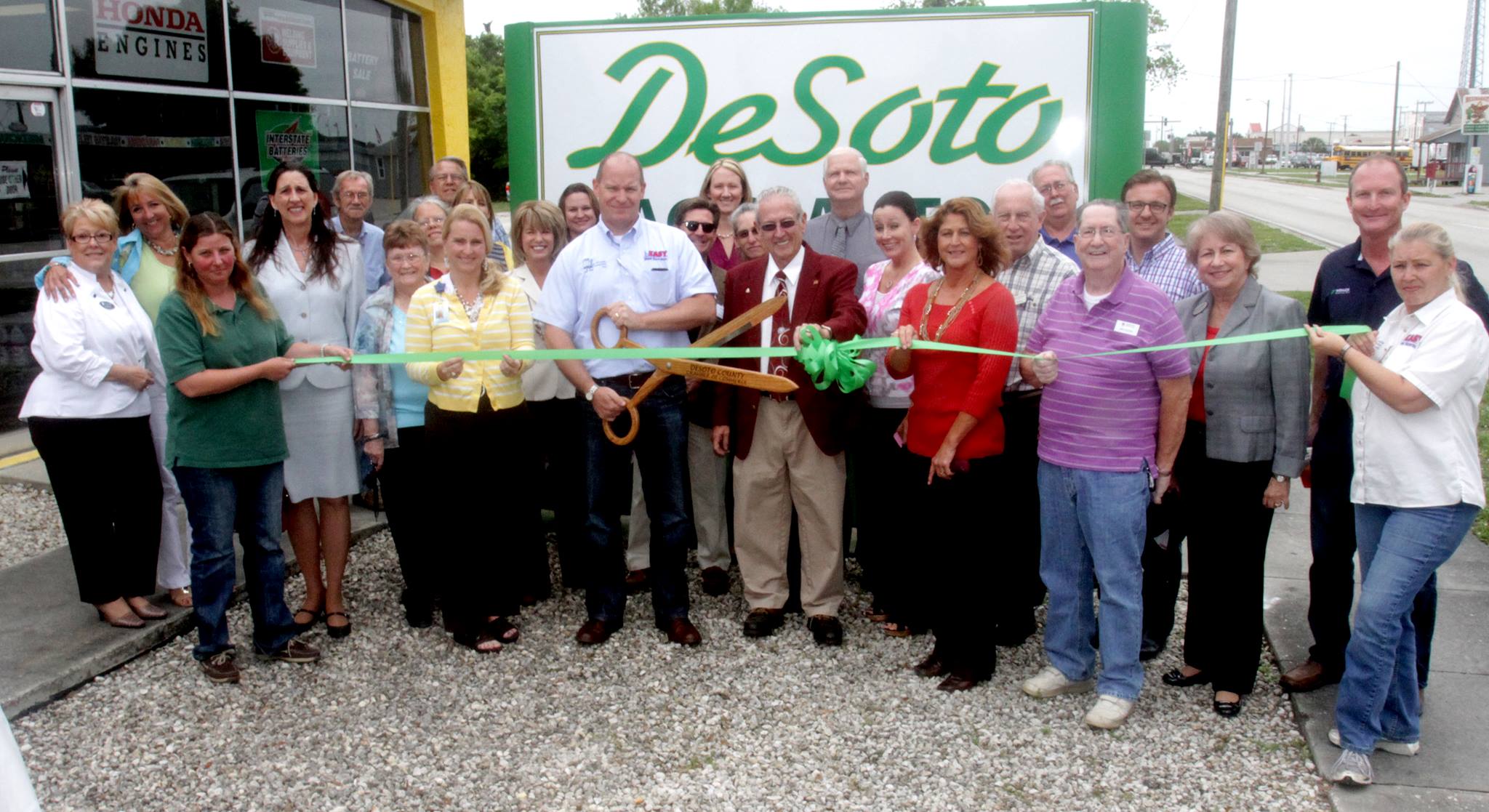 Staff and guests at DeSoto Ag & Auto's ribbon cutting